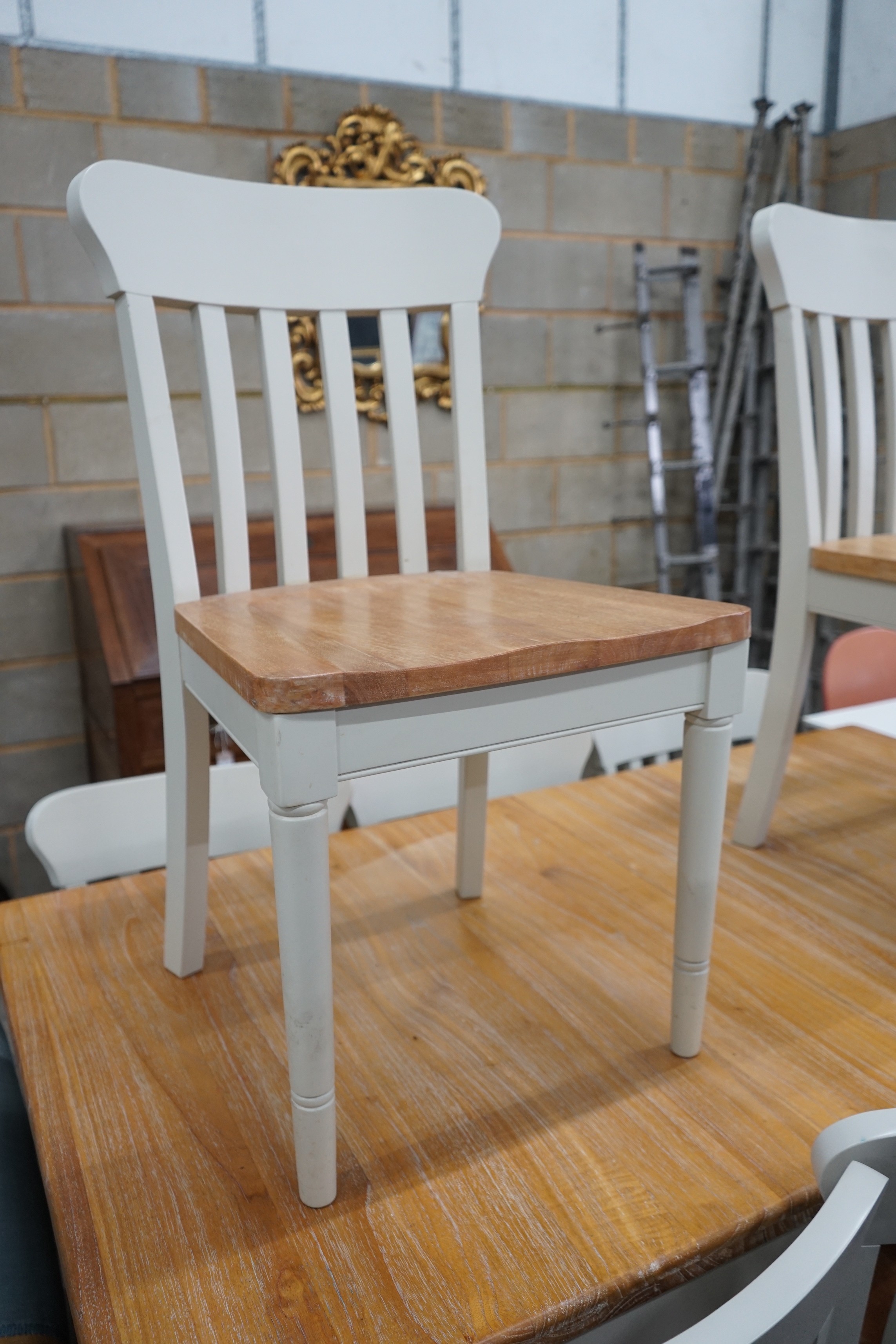 A modern John Lewis part painted extending dining table and eight matching chairs, table width 209cms extended, depth 90cm, height 78cms.